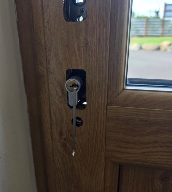 Capital City Locksmith technician fitting a new front door lock in Austin, TX